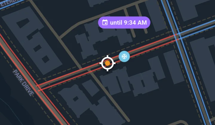 Map detail: the block lines turned red, a light-blue snowflake pill and a purple until 9:34 AM pill next to the location marker